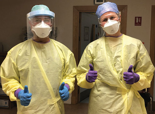Medical professionals wearing full PPE